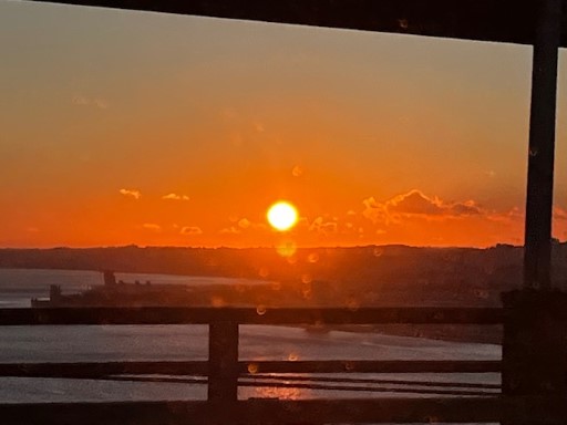 Sunset, over a city, and of a tour…